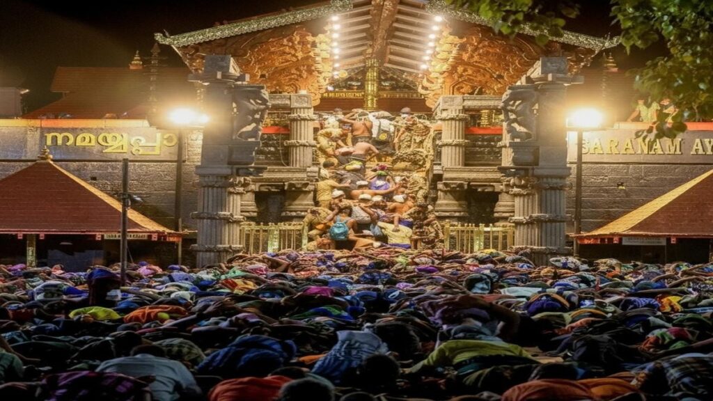 Sabarimala temple devotees following newly arranged pathways during darshan as police manage crowd flow for a smooth experience.