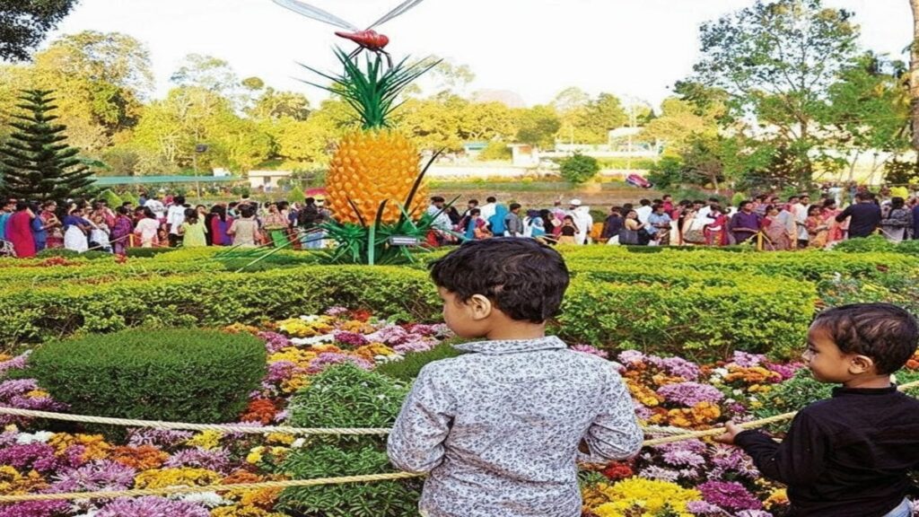 Vibrant flower displays and attractions at the Wayanad Flower Show 2025, with visitors enjoying the festival at Kalpetta Flower Show Ground.
