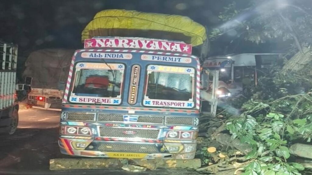 A heavy lorry stranded at the 8th bend of Thamarassery Churam causing traffic congestion and slow vehicle movement.